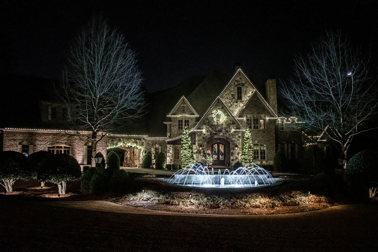 Beds, walk and fountain carrying the front elevation