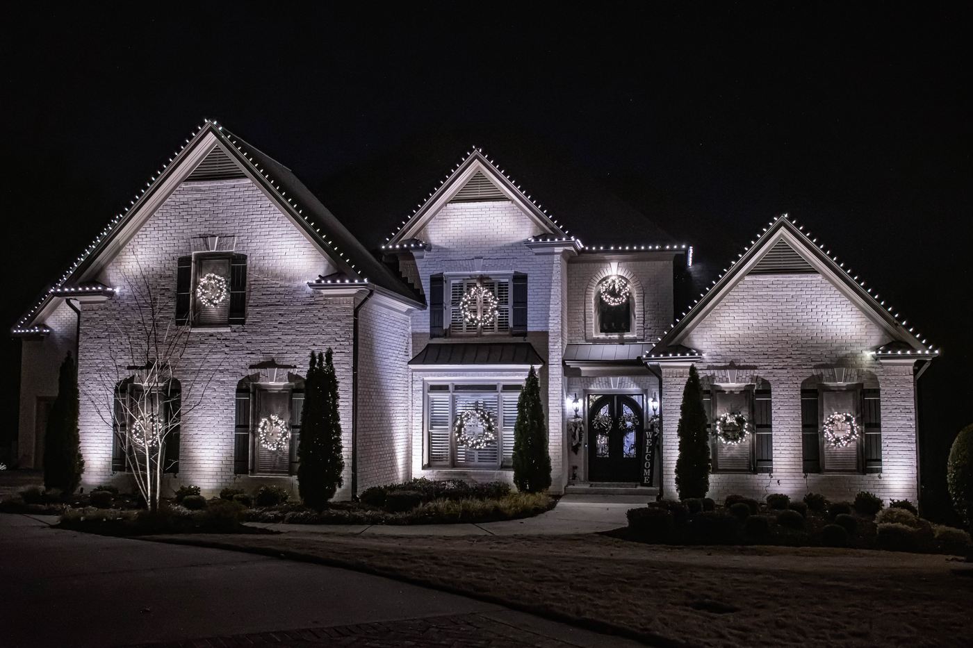 Every ridge and gable in C9, a wreath in every window, facade uplit